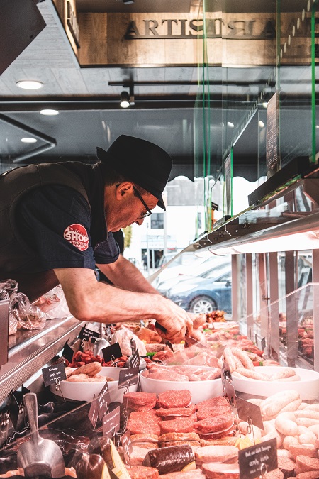 Rural Business Owner at work in his meat shop